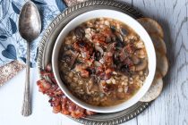 Want a warm soup to serve on a cold winter day? This recipe for Bacon Mushroom Soup with Barley & Wild Rice is ready in less than an hour but tastes like you've been slow cooking it all day! #soup #bacon
